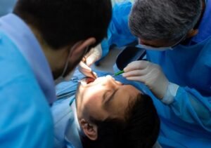 Dentist performing the Best Oral Biopsy Procedure in Greater Noida